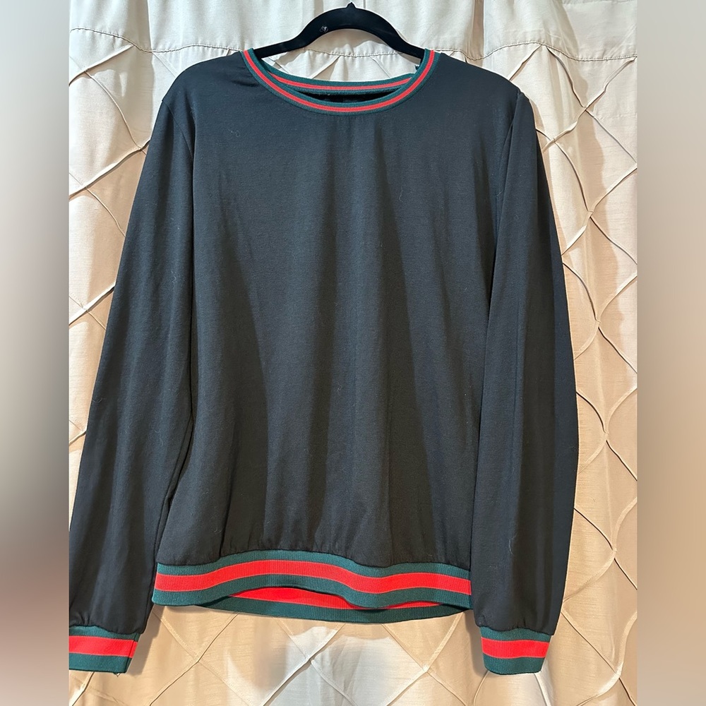 Black top with green and red cuffs